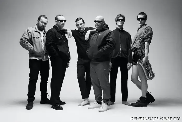 Less than five months after his successful headline performance on the Other Stage at Glastonbury, London rap artist Loyle Carner brought the essence of his fourth studio album ‘Hopefully!’ to the renowned O2 Academy Brixton for a sold-out four-night run, featuring support from talents like Rejjie Snow, Navy Blue, Léa Sen, and Brian Nasty.

Carner’s debut album ‘Yesterday’s Gone’ was released in 2017, and his ascent to fame has been both remarkable and steady since then. His latest album primarily addresses themes of family, showcasing his vulnerability and humility on tracks like ‘About Time’ and ‘Feel at Home’—where he candidly discusses the challenges of managing fatherhood alongside fame and a busy touring schedule. True to his musical style, the overarching themes remain those of love, hope, and gratitude.

He opens the homecoming performance with ‘all i need’—one of the lead singles from the new album that expresses a desire for peace amid life's challenges. As he and the band take the stage, they are greeted with loud, ecstatic cheers that resonate throughout the hour and a half that follows. The excitement momentarily subsides during the transitions between songs, during which Carner expresses his gratitude to the audience, his band, and the venue staff in his signature heartfelt way.

After starting the set with several tracks from ‘Hopefully!’, the crowd's audible joy at the familiar saxophone riff from his 2017 hit ‘Ain’t Nothing Changed’ proved that interest in his earlier work remains strong, despite the influx of new fans he has gained with each album release. This was further confirmed during his performance of ‘Damselfly’, where the entire audience joyfully sang along to Tom Misch’s catchy hook.

At one point, a woman fainted in the crowd. Upon noticing, Carner took a moment to pause the show to check on her and thanked the audience for their composure. Once the situation was under control, he encouraged everyone to take a few deep breaths and expressed appreciation for the venue’s security team for their swift response. “This place gets a bad reputation, but it’s a beautiful, special place, man!” he said to the audience, referring to the venue's negative publicity following the tragic events at a sold-out Asake concert in December 2022 where two fans lost their lives due to an unauthorized entry attempt.

Carner dedicated ‘Homerton’ to the NHS and then welcomed American rapper and professional skateboarder Navy Blue for a soulful performance of ‘Purpose’. The crowd cheerfully filled in for Jorja Smith on the ethereal chorus of ‘Loose Ends’—one of five tracks from Carner’s second album ‘Not Waving, But Drowning’ included in the set.

Similar to his earlier Glastonbury show, Carner's careful arrangement of the performance created a relaxed, contemplative, and immersive experience of jazz-infused hip-hop over the hour and a half. However, it was regrettable to see some of his earlier upbeat tracks, like ‘No CD’ and ‘The Isle of Arran’, not included. The band also enhanced the performance by delivering some exceptionally cool solos, particularly from Portuguese guitarist Raquel Martins, who recently released her debut album ‘LONDON, WHEN ARE U GONNA FEEL LIKE HOME?’ in May, and who also supported Carner during his warm-up shows at KOKO in Camden last month.

Words: Fin Harrison  
Photography: Rory Barnes

Join us on WeAre8, as we delve into global cultural events. Follow Clash Magazine HERE to navigate through clubs, concerts, interviews, and photo shoots with us. Get exclusive backstage glimpses and insights as the fun unfolds.