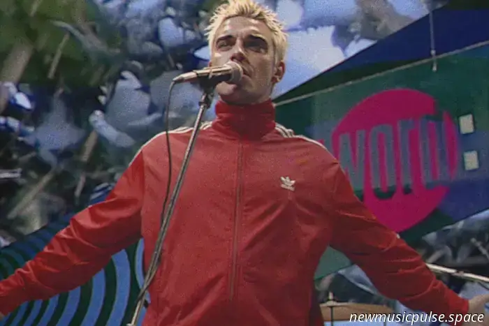 Робби Уильямс возвращается в 90-е в новом клипе «Pretty Face».